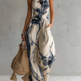 Silvia | Jumpsuit met halternek, abstracte print en wijde pijpen