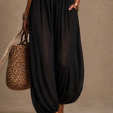 Eulalie | Zwarte bohemian jumpsuit met kant en wijde pijpen