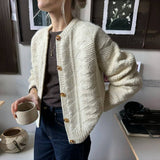 Tilda | Cardigan met lange mouwen en zachte abrikoos tint