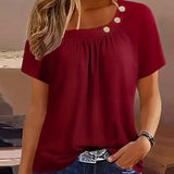 Melina | Blouse met decoratieve knopen en elegante halslijn