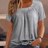 Melina | Blouse met decoratieve knopen en elegante halslijn