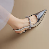 Slingback pumps met kristallen band en puntige neus