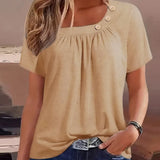 Melina | Blouse met decoratieve knopen en elegante halslijn