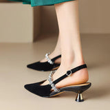 Slingback pumps met kristallen band en puntige neus