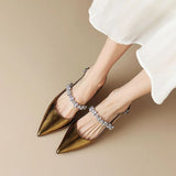 Slingback pumps met kristallen band en puntige neus