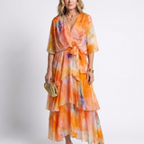Calista | Maxi jurk van transparant materiaal met V-hals en gestrikte taille