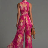 Cayetana | Fuchsia chiffon jumpsuit met bloemenprint en wijde pijpen