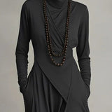Maxi jurk met hoge hals en bohemien elegantie in paars