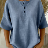 Top met wafelpatroon en knopendetail voor een ontspannen look