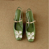 Elegante damesschoen met bloemdetail en lage hak