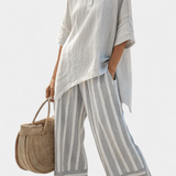 Linnen set met asymmetrische blouse en gestreepte wijde broek