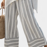 Linnen set met asymmetrische blouse en gestreepte wijde broek